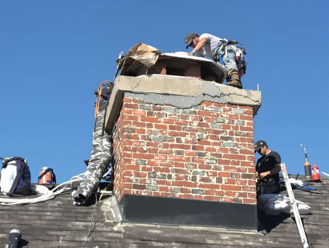 Coral Springs Chimney Sweep installing a custom chimney crown in Coral Springs, FL