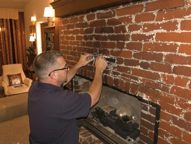 Coral Springs Chimney Sweep expert fixing a fireplace in Coral Springs, FL